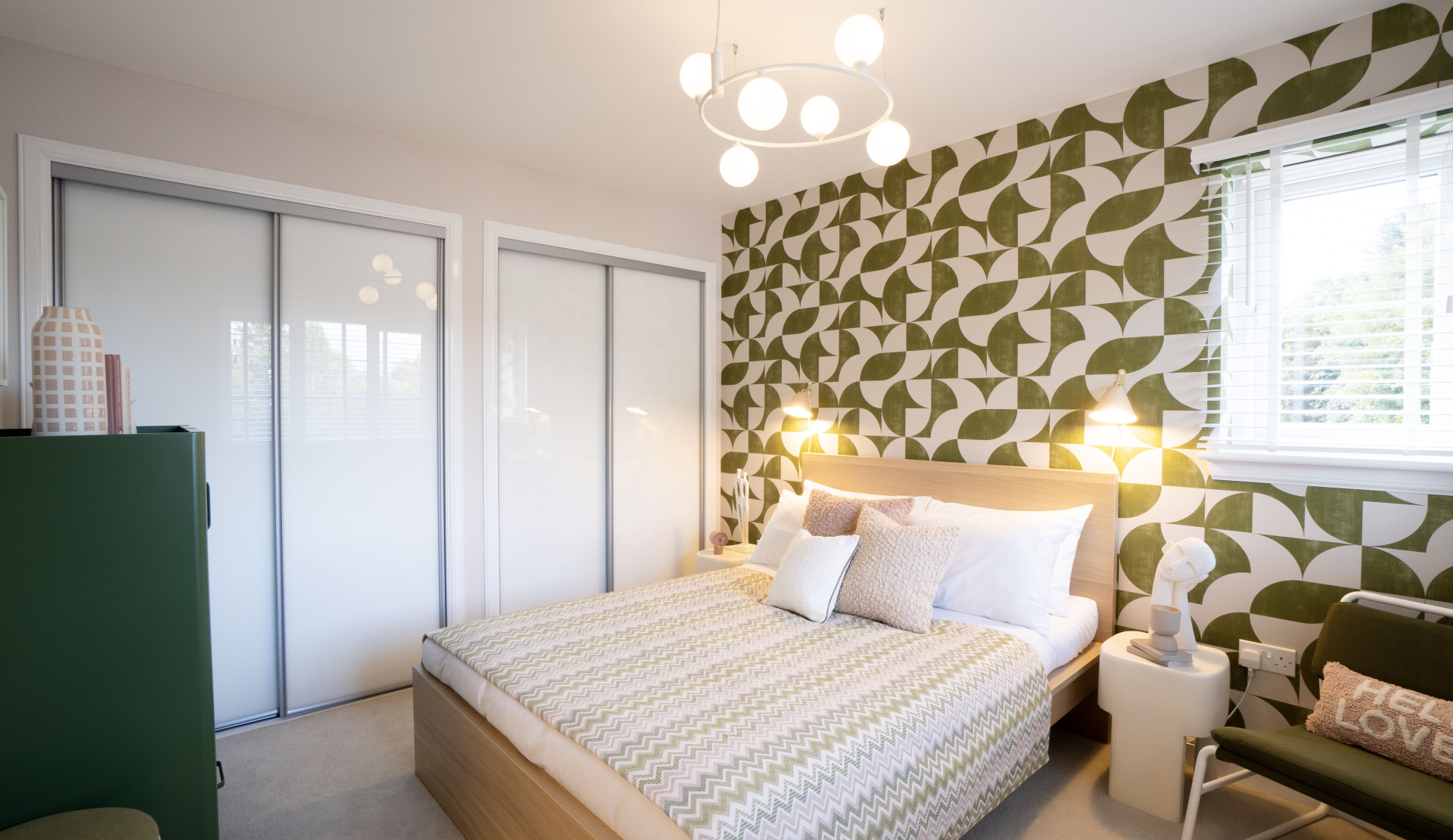 The new show home in Irvine has a bold print wallpaper in the bedroom.